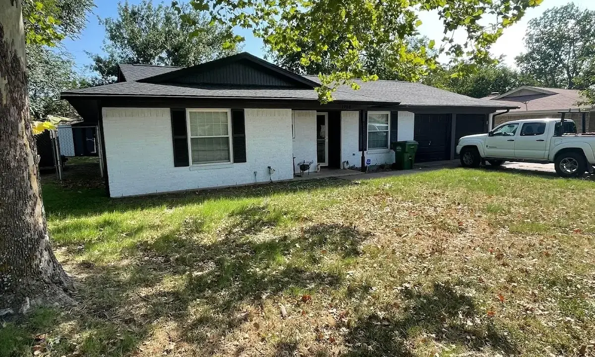 Professional roofing crew working on a residential roof in Fishkill